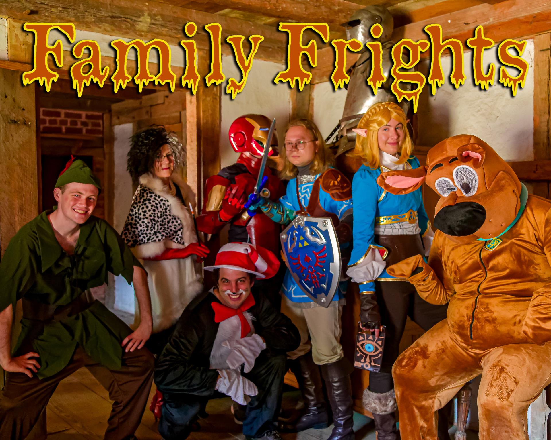 Costumed characters gathered in a James Fort building for Family Frights