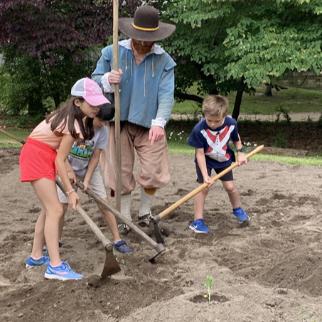 Children help plant vegetables at Jamestown Settlement