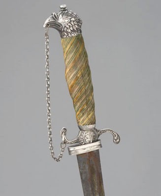 An American silver-hilted, eagle-pommel sword. The scabbard mount is marked by the maker, Richard Humphreys of Philadelphia, and is dated 1776. The sword belonged to Captain William McKissack, an officer who fought in the Revolutionary War. JYF2012.1a-b.