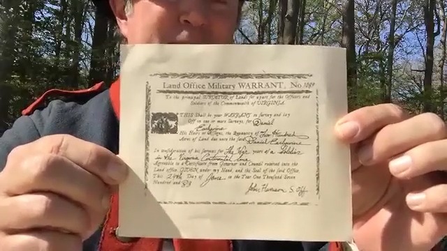Person holding up a Land Office Military Warrant